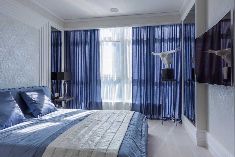 Stylish navy curtains complementing modern home office.